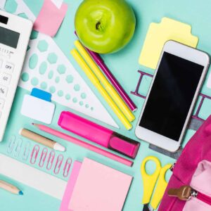 Close Up View Of Various School Supplies On Colorful Surface