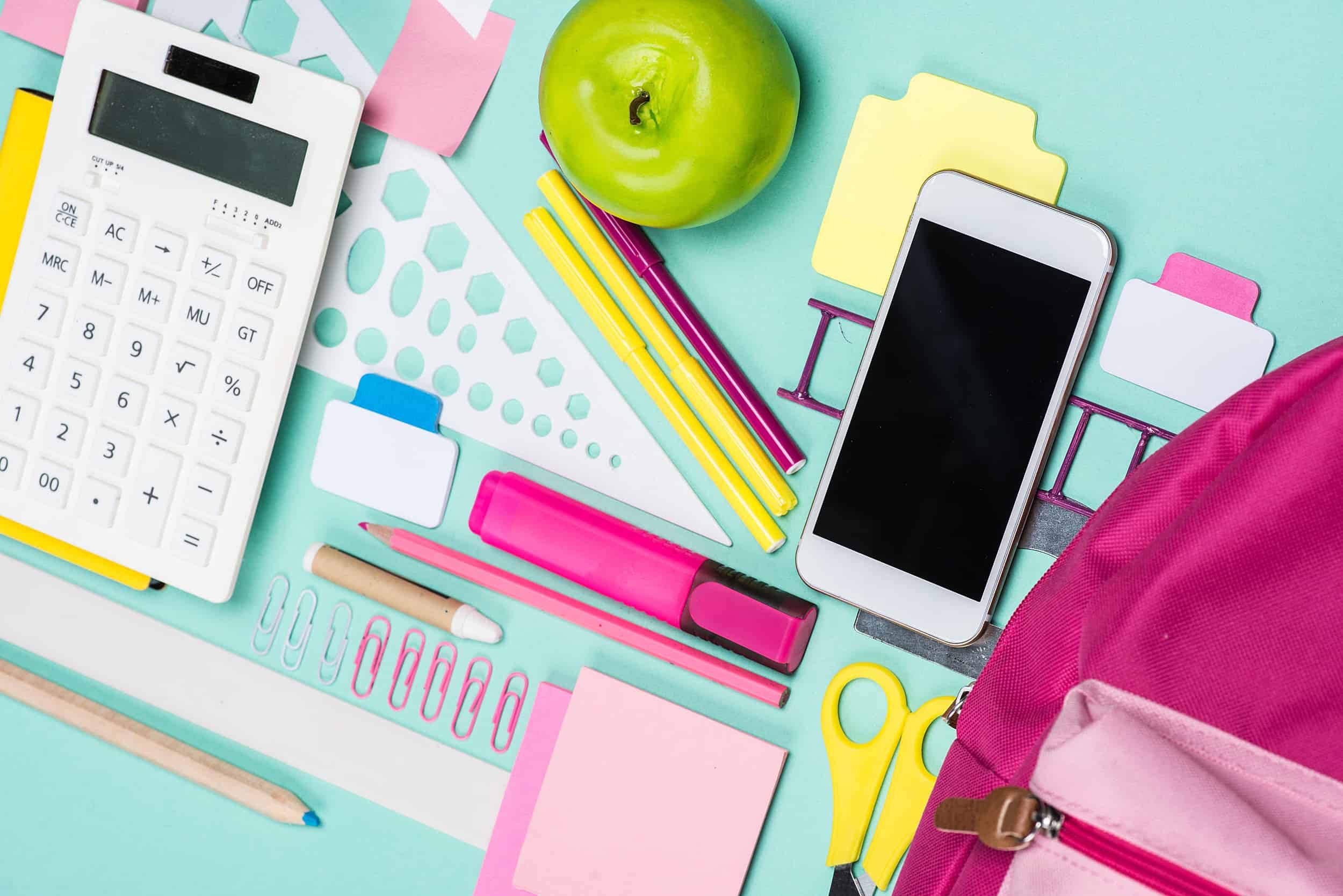 Close Up View Of Various School Supplies On Colorful Surface